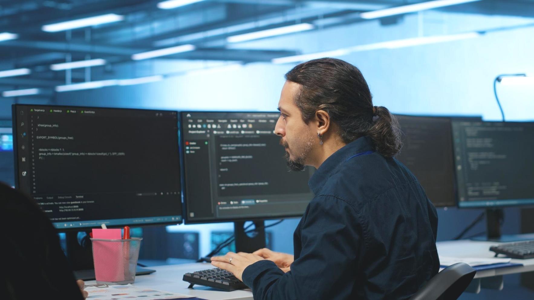Security bootcamp classroom with developers working on code protection techniques